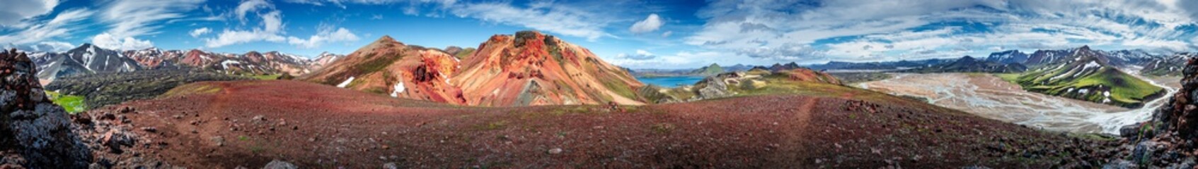 Panoramic 360 degrees landscape view of colorful rainbow volcanic Landmannalaugar mountains, volcanoes, lava fields and campsite at blue sky, Iceland