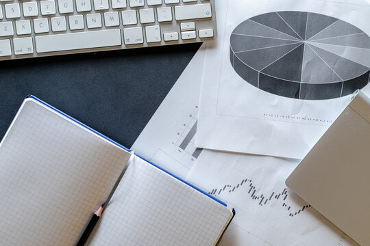 Notebook background. Charts graphs diagram in office. Finance control and analysis concept. Concept image of data gathering and statistical working.