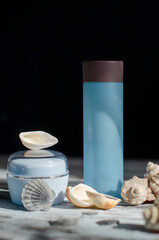 blue jar with a cosmetic product with shells and pearls