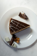 Napoleon cake on a table with sweets