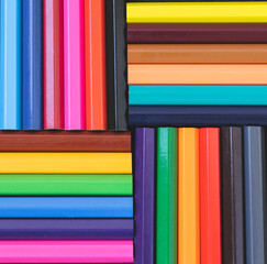   A palette of colored pencils. Composition of colored pencils. Multi-colored stationery. Goods for school and kindergarten. Concept.