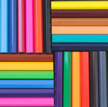   A palette of colored pencils. Composition of colored pencils. Multi-colored stationery. Goods for school and kindergarten. Concept.