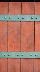 Dark wooden boards with metal fasteners for background
