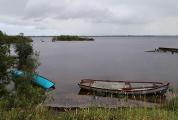 Obraz premium Old rowing boats abandoned on the shore of Lough Mask, County Mayo, Ireland.