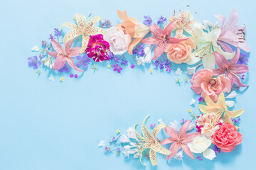 frame of beautiful garden flowers on paper background