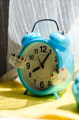 bright blue alarm clock on the windowsill