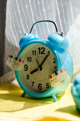 bright blue alarm clock on the windowsill