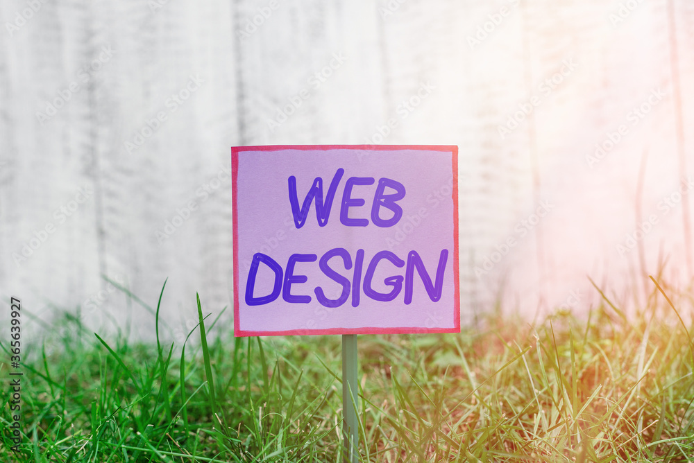 Fototapete Text sign showing Web Design. Business photo text website creation which includes layout, content, and graphics Plain empty paper attached to a stick and placed in the green grassy land
