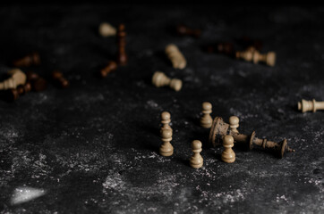 chess on the table next to a stack of books