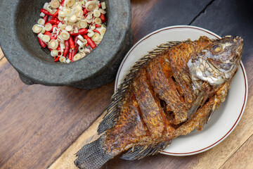 Nile Tilapia fish after fried on white plate
