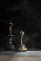 old wooden chess on black background in smoke