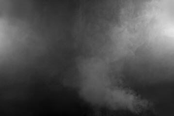 Fototapeta premium White smoke on a black background. The texture of scattered smoke. Blank for design. Layout for collages.