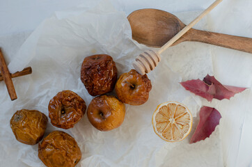 baked apples with honey on a clay plate