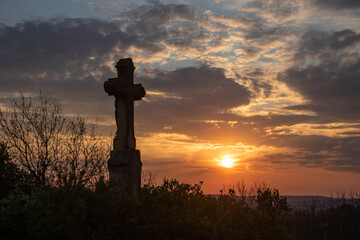 silhouette of a cross in the sunset
