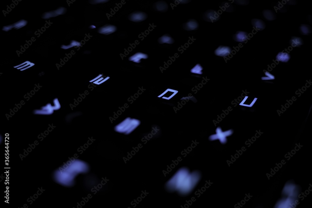 Canvas Prints Macro shot of a black keyboard with blue LED light for the letters