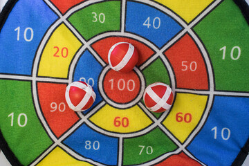 background from a children's game of Darts with plastic balls