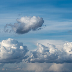 Abstract natural background, sky and puffy clouds,