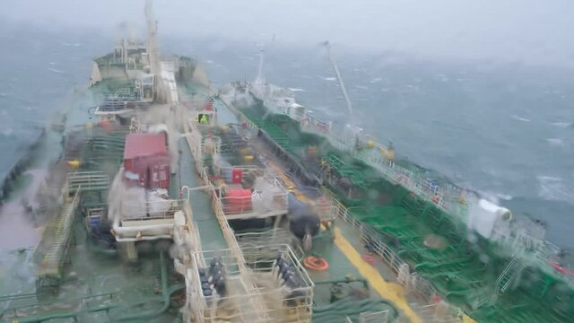moored large industrial Natig Aliev and Rina tankers drift across sea during heavy storm at Danish port of Skagen raid