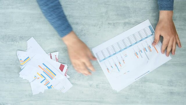 Top View Of Businessman Analyzing And Ripping Business Report. Financial And Failure Business Concept. Close Up