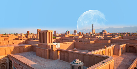 Historic City of Yazd with famous wind towers in the background full moon - YAZD, IRAN "Elements of this image furnished by NASA"
