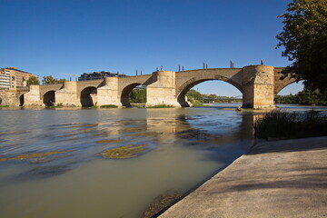 Fototapeta na wymiar Stone bridge Puente de Piedra over the river Ebro in Zaragoza,Spain,Europe 