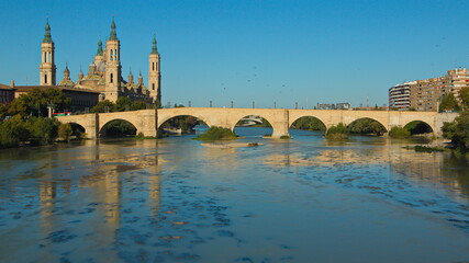 Obraz premium Cathedral-Basilica of Our Lady of the Pillar and stone bridge Puente de Piedra over the river Ebroin in Zaragoza,Spain,Europe 