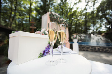 Wedding glasses with champagne on the table