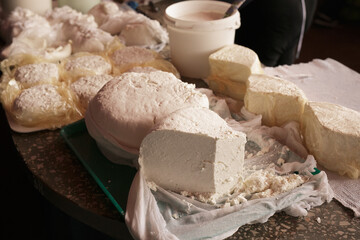 Close-up shot of fresh DELICIOUS homemade cottage cheese on the table in grandmother's house in the village. Shallow DOF