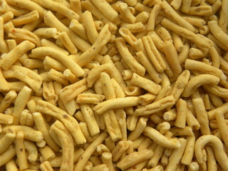 Yellow color fried Ratlami sev spicy Indian snack made from chickpea flour