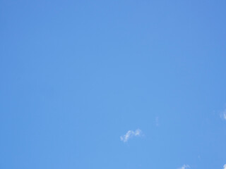 Naklejka na ściany i meble Bright blue sky with clouds