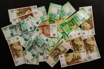Obraz na płótnie Canvas russian money paper rubles lying on the table