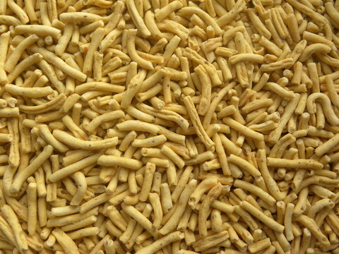 Yellow color fried Ratlami sev spicy Indian snack made from chickpea flour