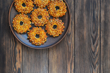 Homemade cookies or rings with crushed peanuts. Flour product