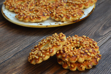 Homemade cookies or rings with crushed peanuts. Flour product