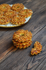 Homemade cookies or rings with crushed peanuts. Flour product
