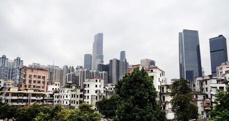 City skyline with an interesting cloudy sky behind. Panorama of full skyline with all the towers and buildings.
