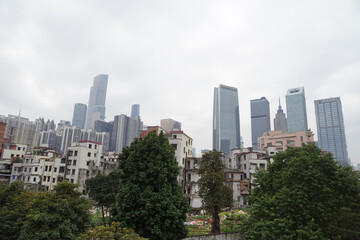 City skyline with an interesting cloudy sky behind. Panorama of full skyline with all the towers and buildings.