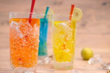 Cool drinks and summer alcoholic cocktail on wood table, space for text