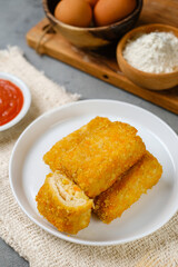 Delicious Risoles or Risol Mayo is a typical Indonesian traditional street food made from flour skin, meat and vegetables stuffing inside with mayonnaise and chili sauce.