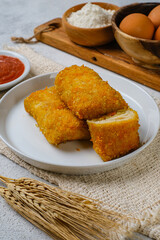 Delicious Risoles or Risol Mayo is a typical Indonesian traditional street food made from flour skin, meat and vegetables stuffing inside with mayonnaise and chili sauce.