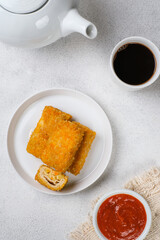 Delicious Risoles or Risol Mayo is a typical Indonesian traditional street food made from flour skin, meat and vegetables stuffing inside with mayonnaise and chili sauce.
