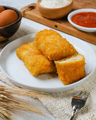 Delicious Risoles or Risol Mayo is a typical Indonesian traditional street food made from flour skin, meat and vegetables stuffing inside with mayonnaise and chili sauce.