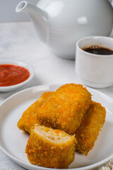 Delicious Risoles or Risol Mayo is a typical Indonesian traditional street food made from flour skin, meat and vegetables stuffing inside with mayonnaise and chili sauce.