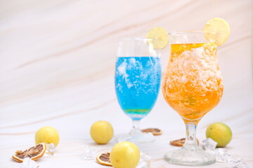 Refreshing summer drinks with alcohol on table background and cool drinks with lemonade, space for text