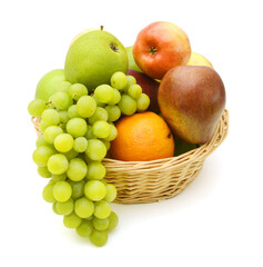 Naklejka na ściany i meble Fresh organic fruits in wicker basket on white background