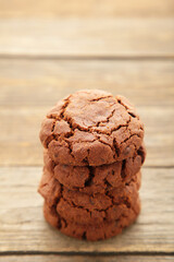 Chocolate chips cookies on grey wooden background.