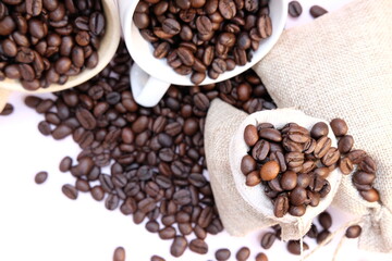 Top view coffee cup and coffee beans on wood table, space for text