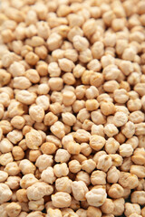 Dry raw organic chickpeas background. Top view