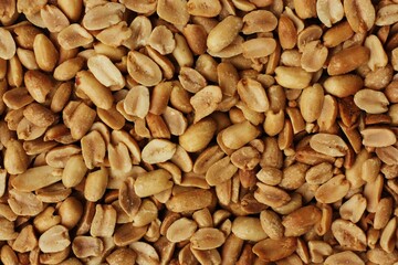 Delicious roasted peanuts with salt close up view