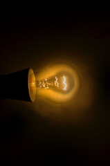 An incandescent light bulb or incandescent light globe is an electric light with a wire filament...